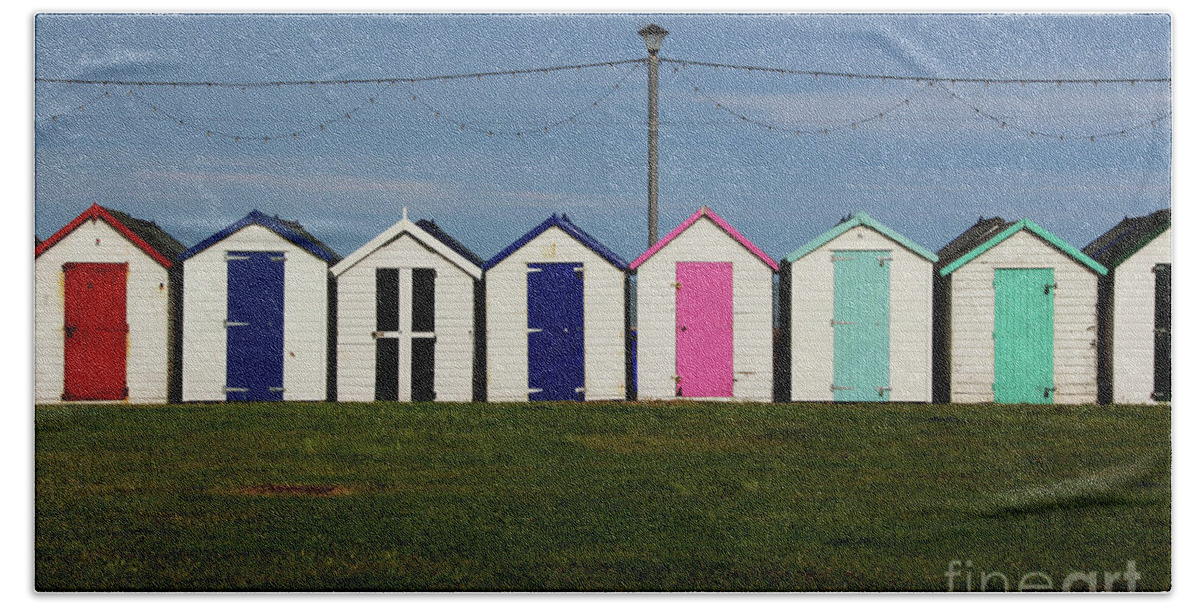 Beach Huts Bath Towel featuring the photograph Holiday beach huts by Tom Conway