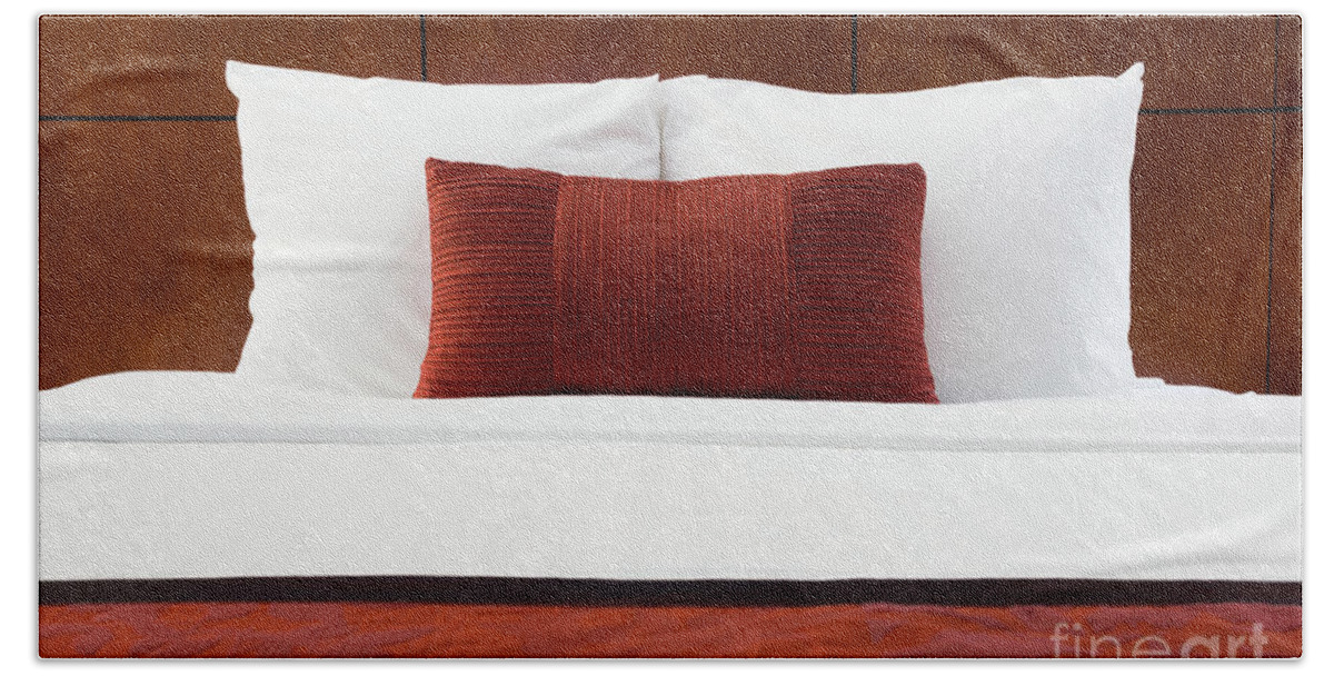 Bedding Hand Towel featuring the photograph Hotel Room Bed and Pillows by Paul Velgos