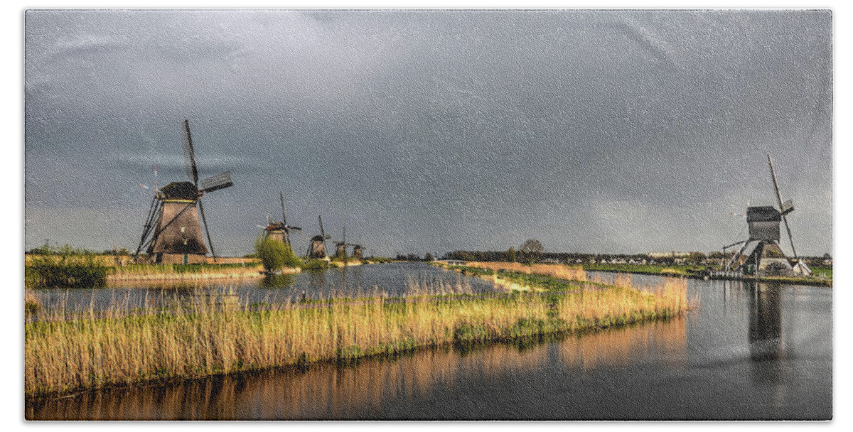 Windmill Bath Towel featuring the photograph Kinderdijk Windmills After The Rain by Frans Blok