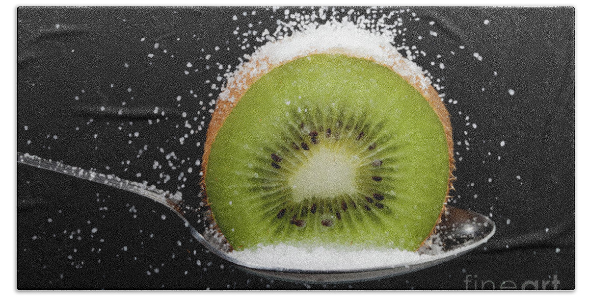 Kiwi Bath Towel featuring the photograph Kiwi fruit cut in half on a spoon with sugar by Simon Bratt