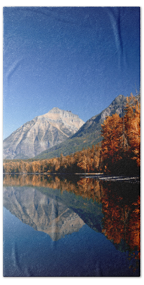 Lawrence Hand Towel featuring the photograph Lake McDonald Autumn by Lawrence Boothby