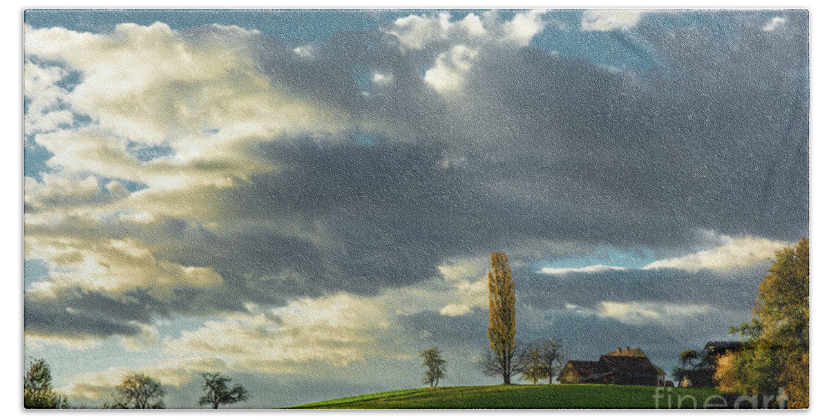 Landscape Hand Towel featuring the photograph Landscape With House and Sunlit Hill in Austria by Andreas Berthold