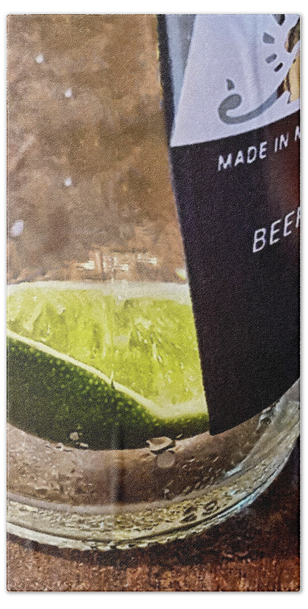Greg Jackson Hand Towel featuring the photograph Lime Slice in Cervesa Bottle by Greg Jackson