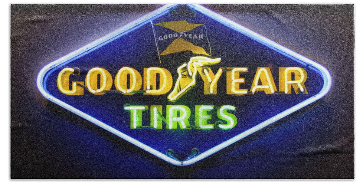 Transportation Bath Towel featuring the photograph Neon Goodyear Tires Sign by Mike McGlothlen