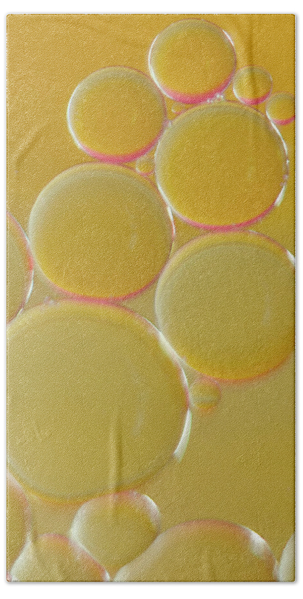 Water Hand Towel featuring the photograph Oil bubbles on water abstract by Andy Myatt