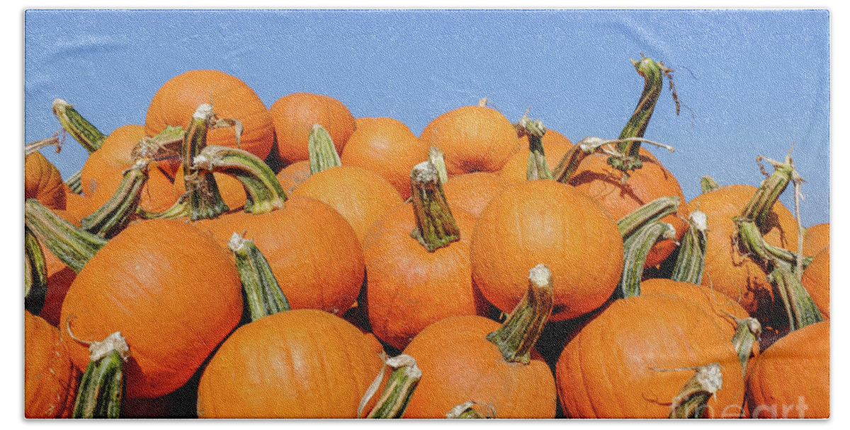 Pumpkin Hand Towel featuring the photograph Pile of pumpkins by Iryna Liveoak