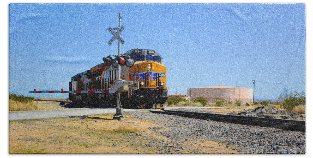 Railway Crossing; Railroad Crossing; Train Crossing; Union Pacific; Freight Train; Yellow; Blue; Green; Red; Water Storage; Train Tracks; Train Signal; Mojave Desert; Mohave Desert; Antelope Valley; Joe Lach Bath Towel featuring the photograph Railway Crossing by Joe Lach