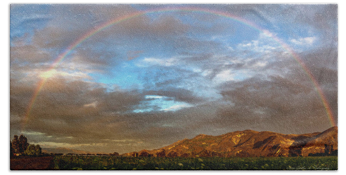 Rainbow Bath Towel featuring the photograph Rainbow over South Mountain at Santa Paula, CA by John A Rodriguez