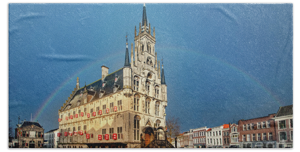 Gouda Bath Towel featuring the photograph Rainbow over Town Hall Gouda by Casper Cammeraat