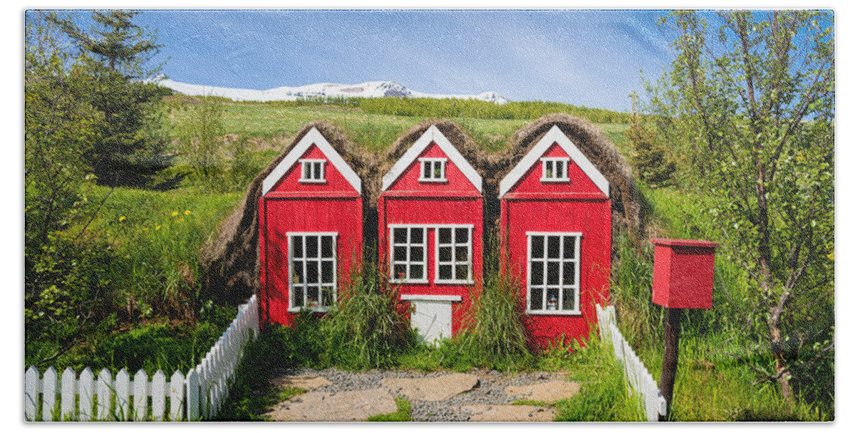 Elf Houses Bath Towel featuring the photograph Red elf houses in Iceland for the Icelandic hidden people by Matthias Hauser