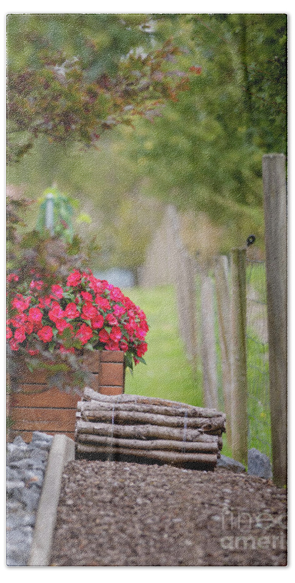 Country Hand Towel featuring the photograph Red flowerd with Fende and wood billet bundle by Amanda Mohler
