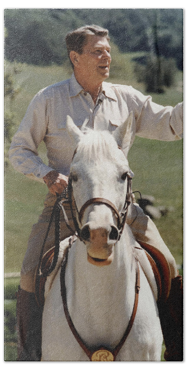 Ronald Reagan Bath Sheet featuring the photograph Ronald Reagan On Horseback by War Is Hell Store