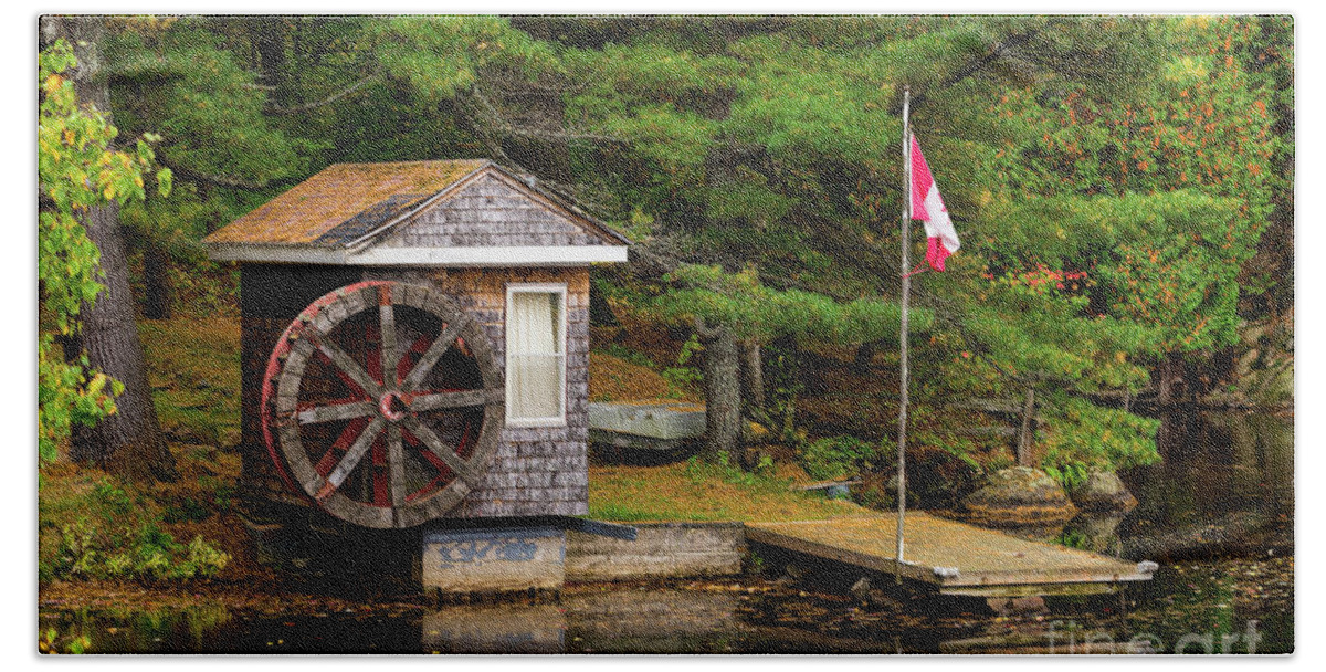 Colors Bath Towel featuring the photograph Small shed with a large wooden wheel by Les Palenik