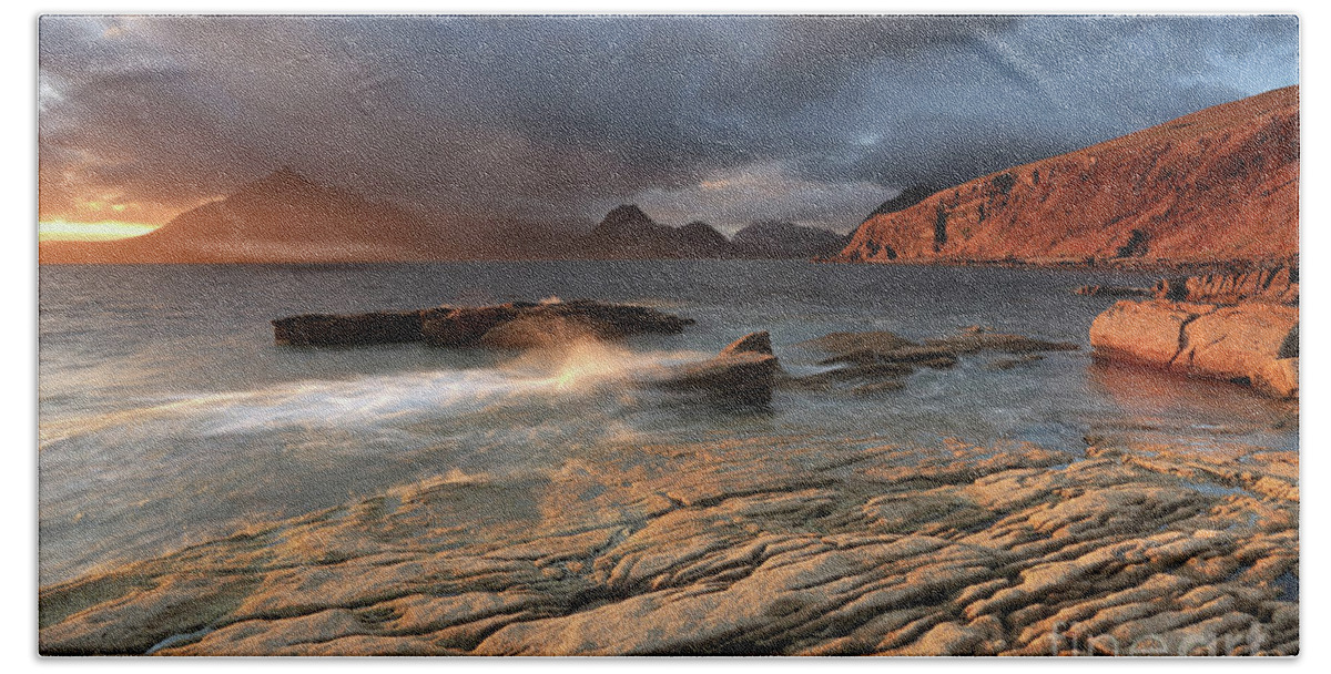 Elgol Bath Towel featuring the photograph Splashing waves and the Cuillins at Sunset by Maria Gaellman