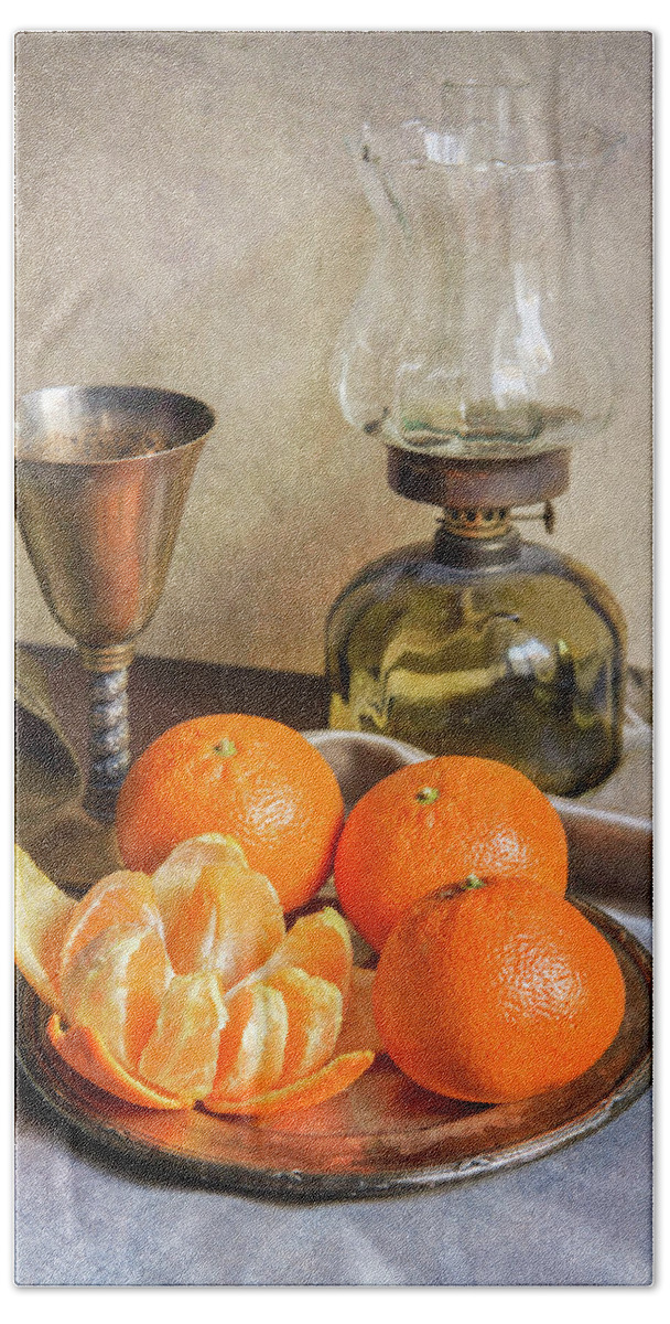 Still Life Hand Towel featuring the photograph Still life with oil lamp and fresh tangerines by Jaroslaw Blaminsky