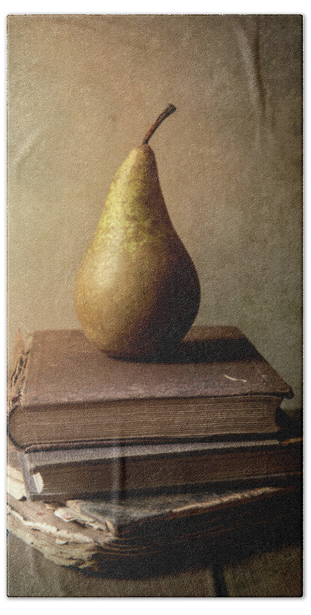 Book Bath Towel featuring the photograph Still life with old books and fresh pear by Jaroslaw Blaminsky