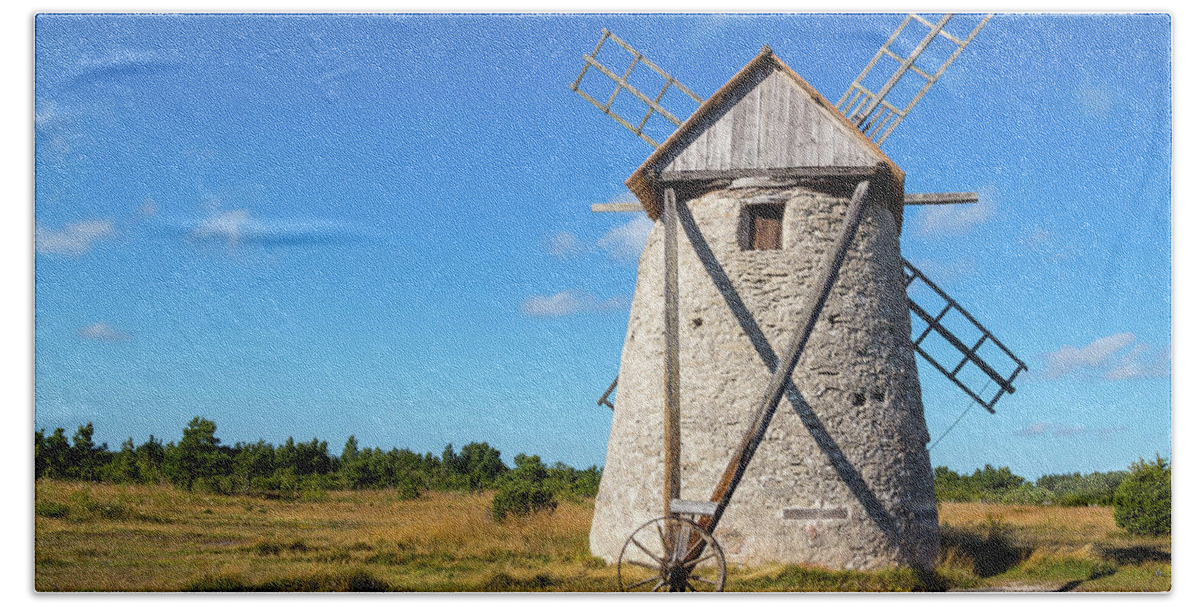 Windmill Hand Towel featuring the photograph Stone windmill in Gotland, Sweden by GoodMood Art