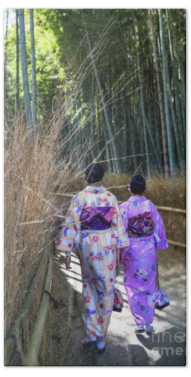 Stroll Hand Towel featuring the photograph Stroll in the Arashiyama Bamboo Grove by Karen Jorstad