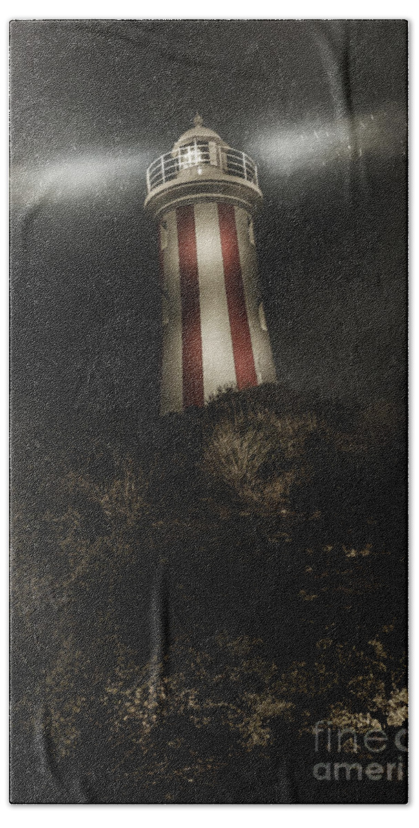 Mystery Bath Towel featuring the photograph Tasmania lighthouse in rain storm. Guiding light by Jorgo Photography