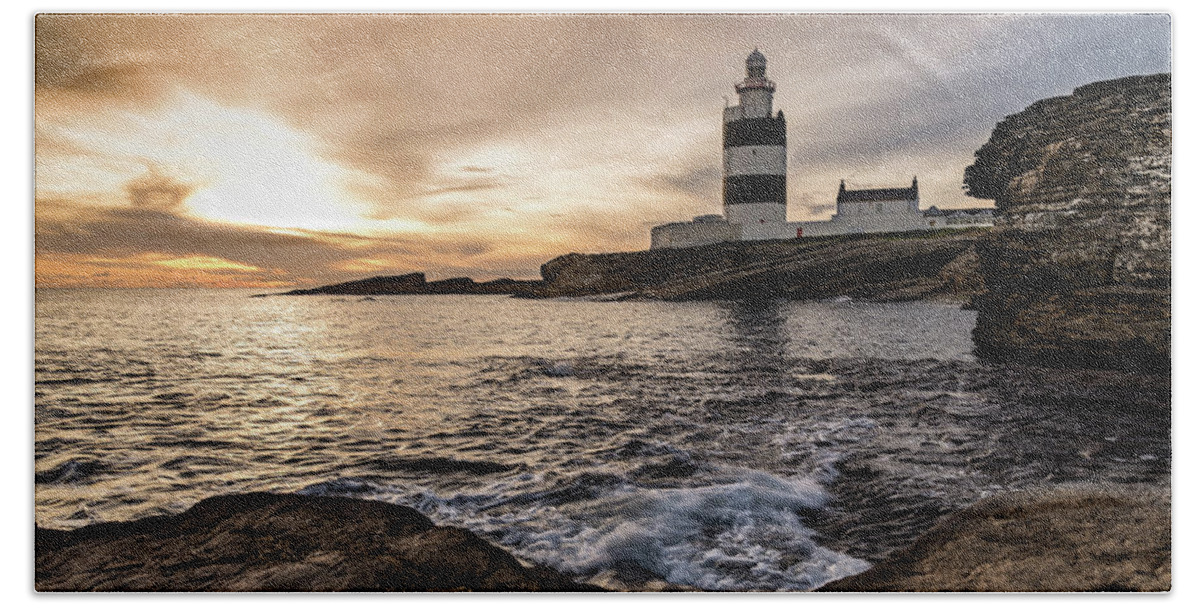 Hook Lighthouse Hand Towel featuring the photograph The Hook at Sunset by Martina Fagan