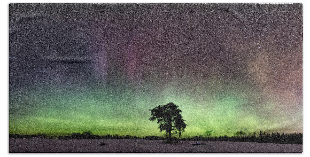 Abstract Bath Towel featuring the photograph The Lone Tree early March Aurora panorama by Jakub Sisak