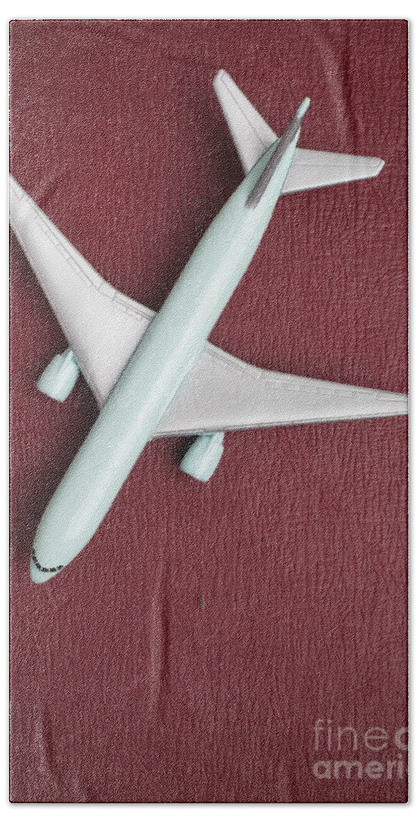 Still Life Hand Towel featuring the photograph Toy Airplane over Red Book Cover by Edward Fielding