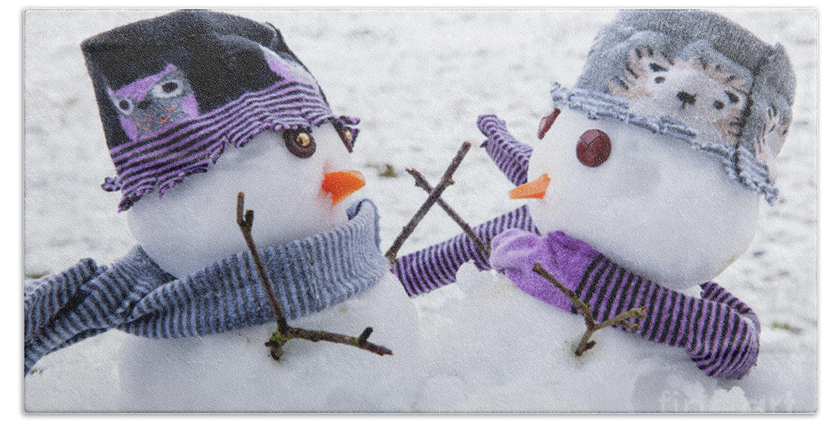 Snowmen Bath Towel featuring the photograph Two cute snowmen friends embracing by Simon Bratt