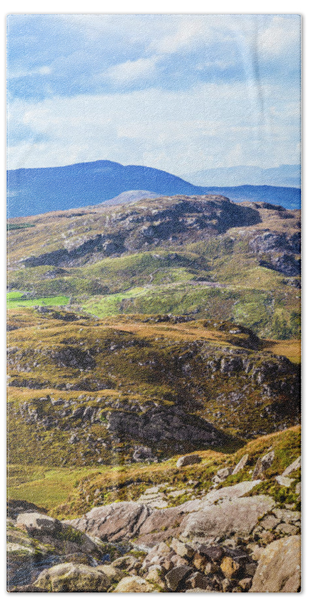 Blue Hand Towel featuring the photograph Undulating green, purple and yellow rocky landscape in Ireland by Semmick Photo