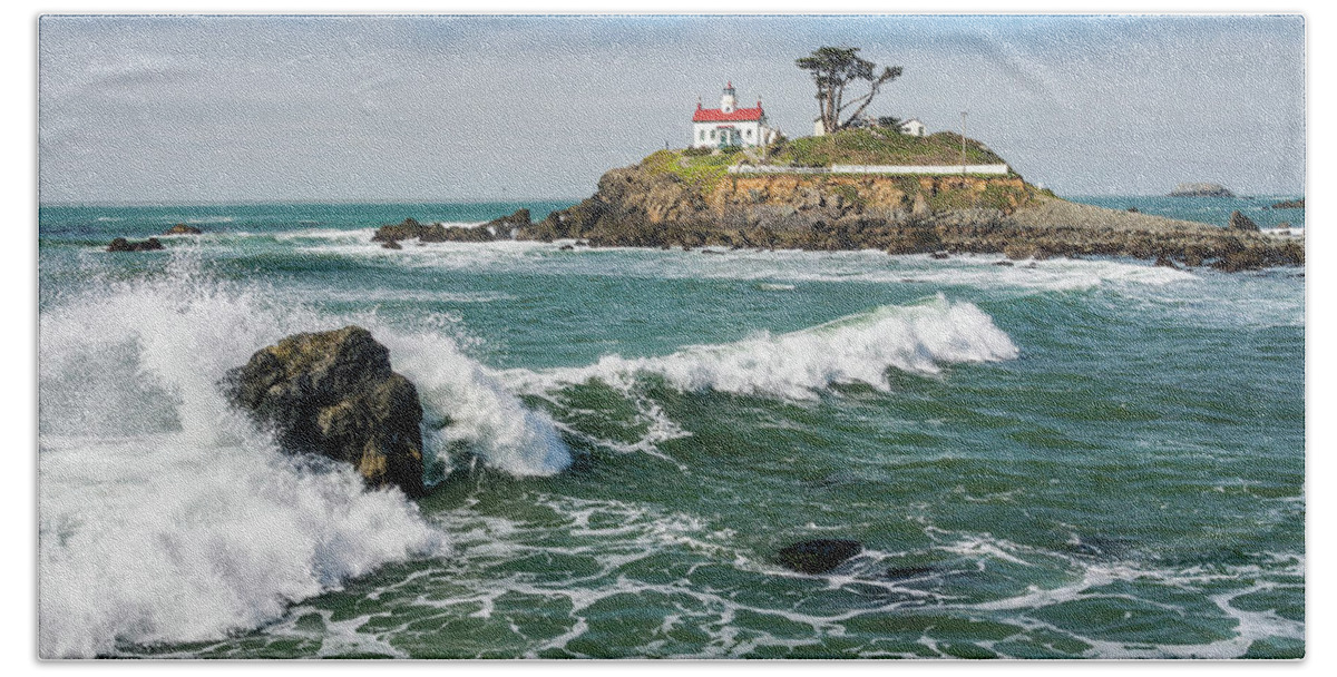 Crescent City Hand Towel featuring the photograph Wave Break and the Lighthouse by Greg Nyquist