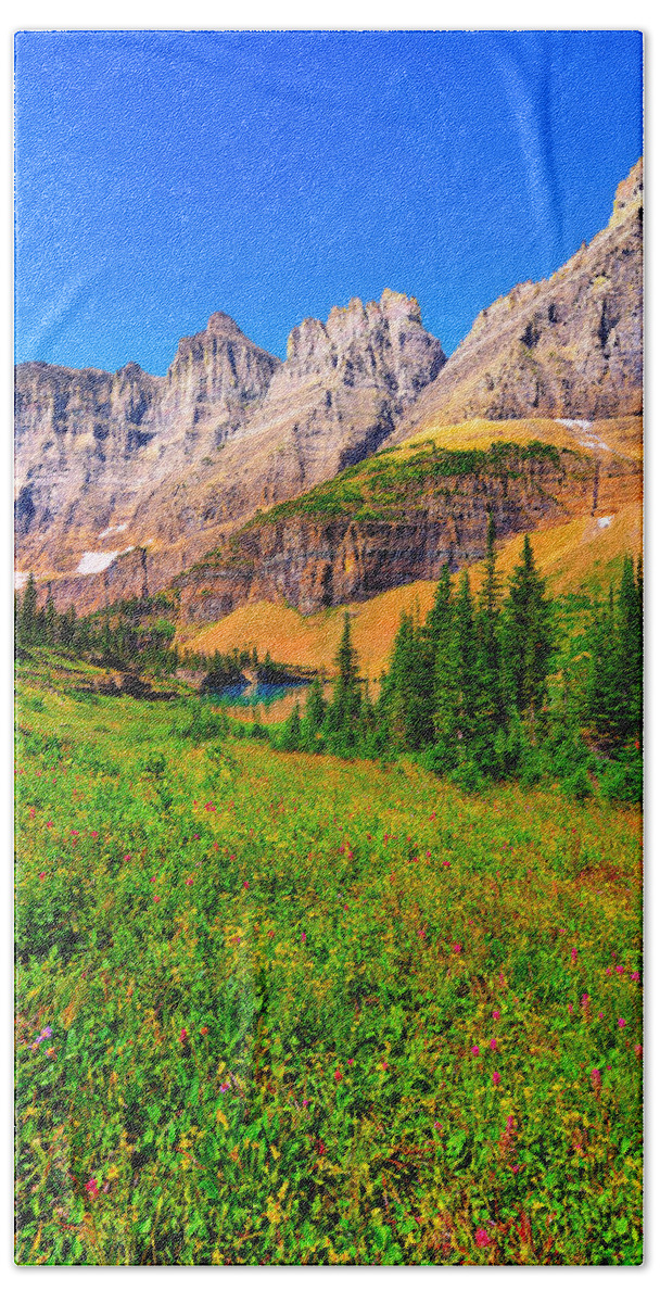 Glacier National Park Bath Towel featuring the photograph Wildflower Meadow Beneath the Ptarmigan Wall by Greg Norrell