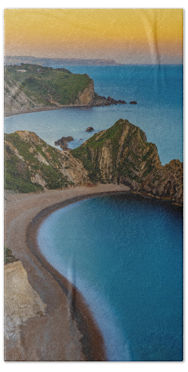 Cliffs Hand Towel featuring the photograph Sunset at Durdle door in England by George Afostovremea