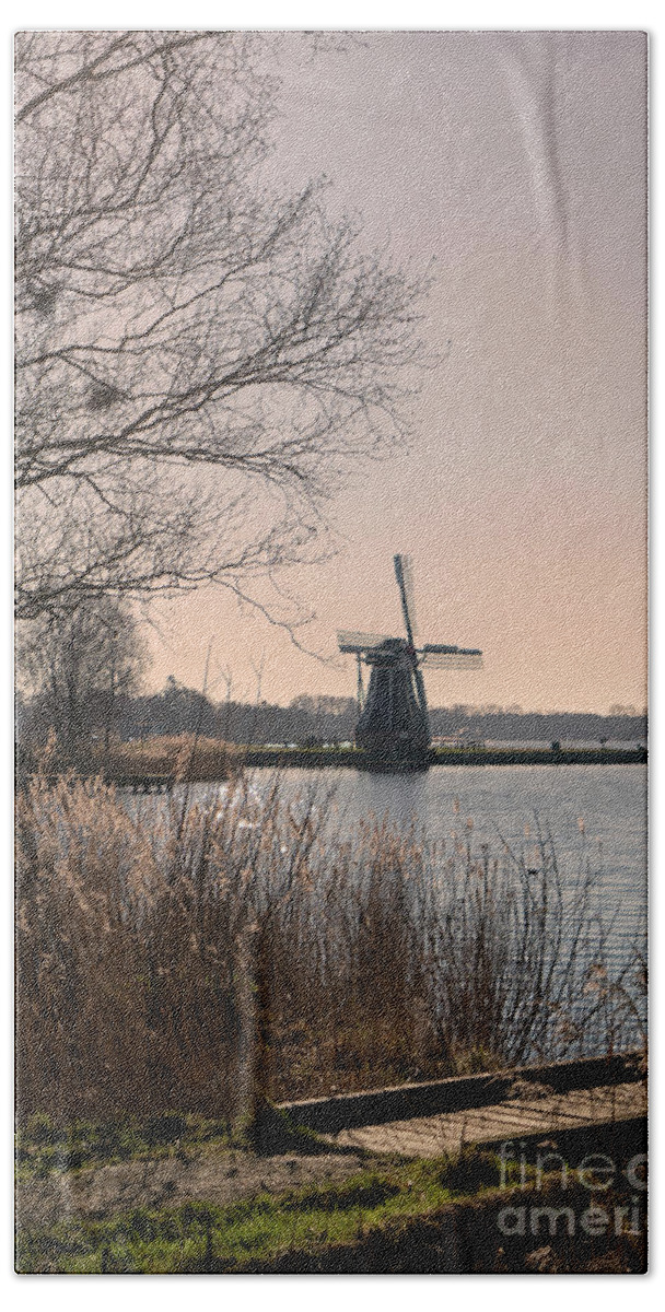 Blue Bath Towel featuring the photograph Windmill on a lake in the Netherlands by Patricia Hofmeester