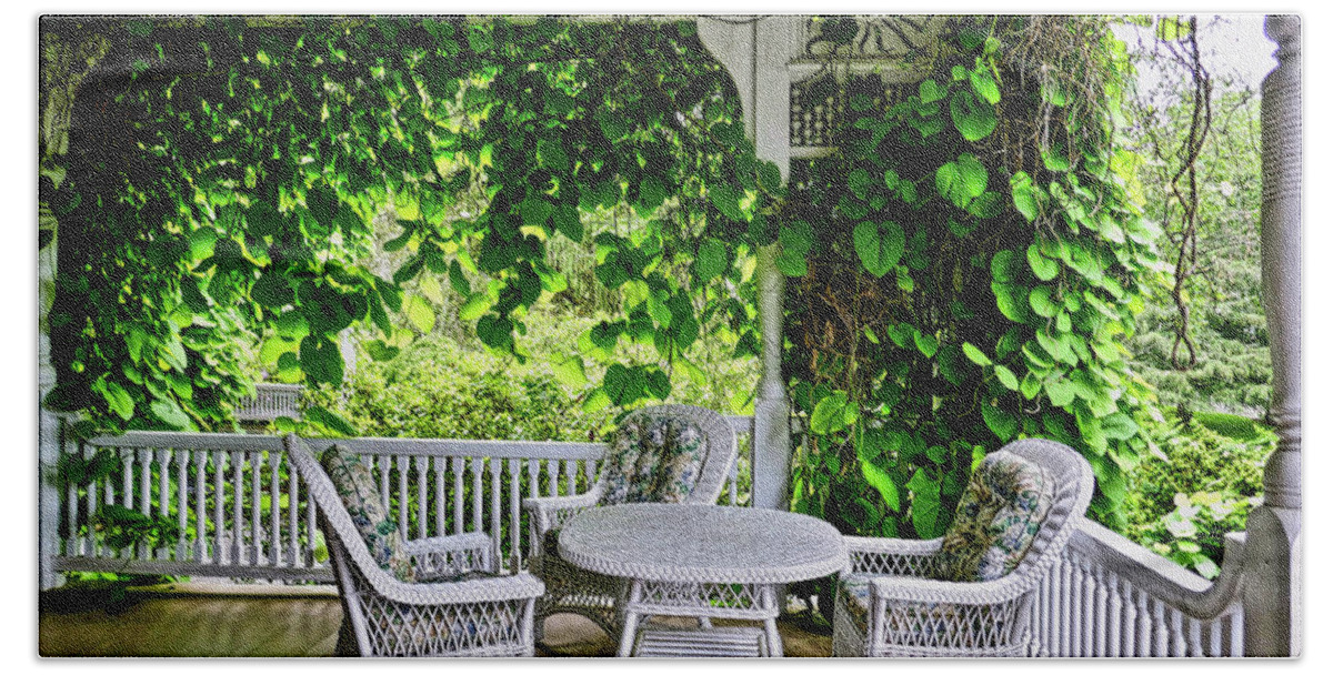 Beautiful Color Photograph Of Porch With Wicker Table And Chairs Hand Towel featuring the photograph A Beautiful Porch View by Joan Reese