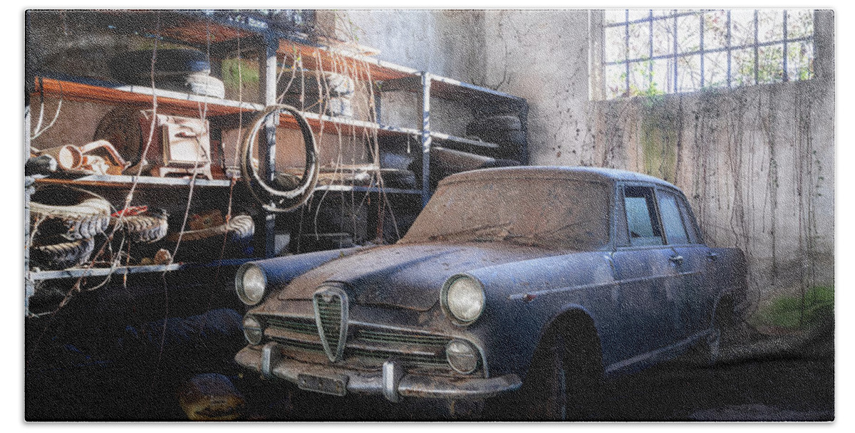 Urban Bath Towel featuring the photograph Abandoned Car in Garage by Roman Robroek