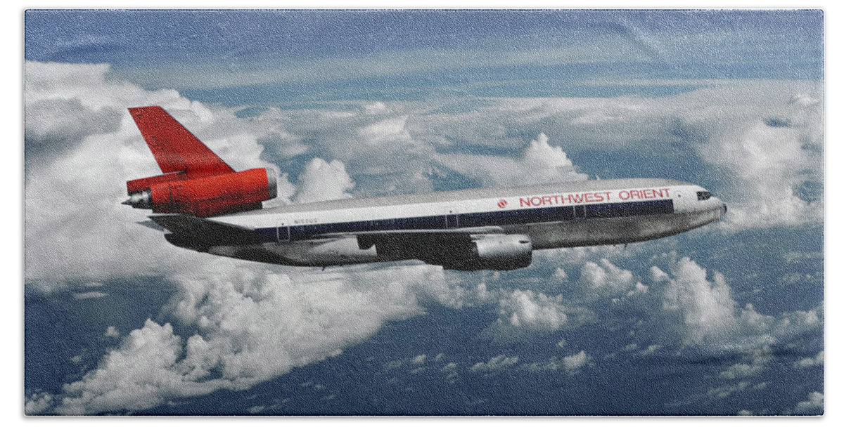 Northwest Orient Airlines Bath Towel featuring the mixed media Among the Clouds - Northwest Orient DC-10-40 by Erik Simonsen