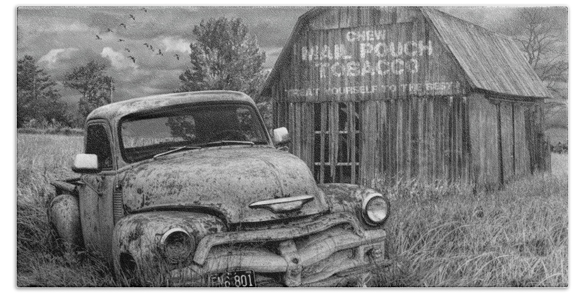 Chevy Bath Towel featuring the photograph Black and White of Rusted Chevy Pickup Truck in a Rural Landscape by a Mail Pouch Tobacco Barn by Randall Nyhof