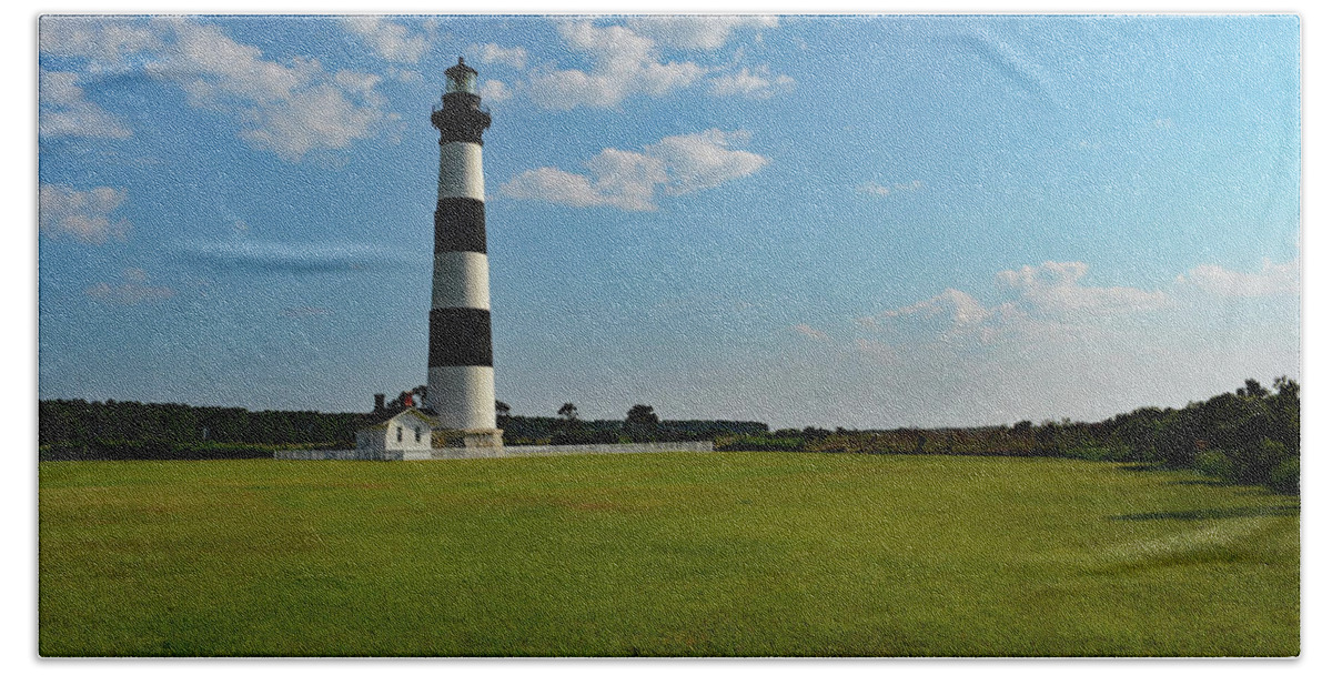 Bodie Island Lighthouse Bath Towel featuring the photograph Bodie Island Lighthouse Under the Clouds by Jimmie Bartlett