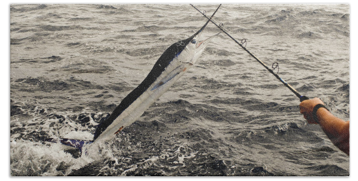 Stripped Marlin Bath Towel featuring the photograph Fisherman and Marlin battle off stern of sport fishing boat by David Shuler