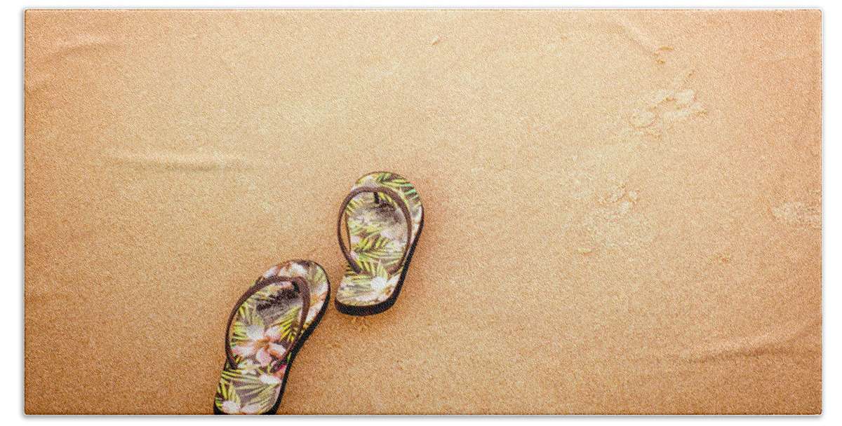 Beach Life Hand Towel featuring the photograph Flip-Flops On The Sand. by Jeff Sinon