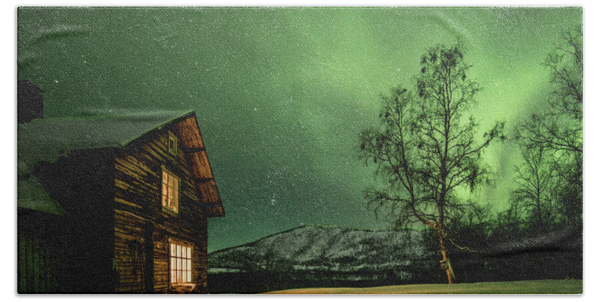Aurora Hand Towel featuring the photograph Lights of nature, lights of man by Pekka Sammallahti