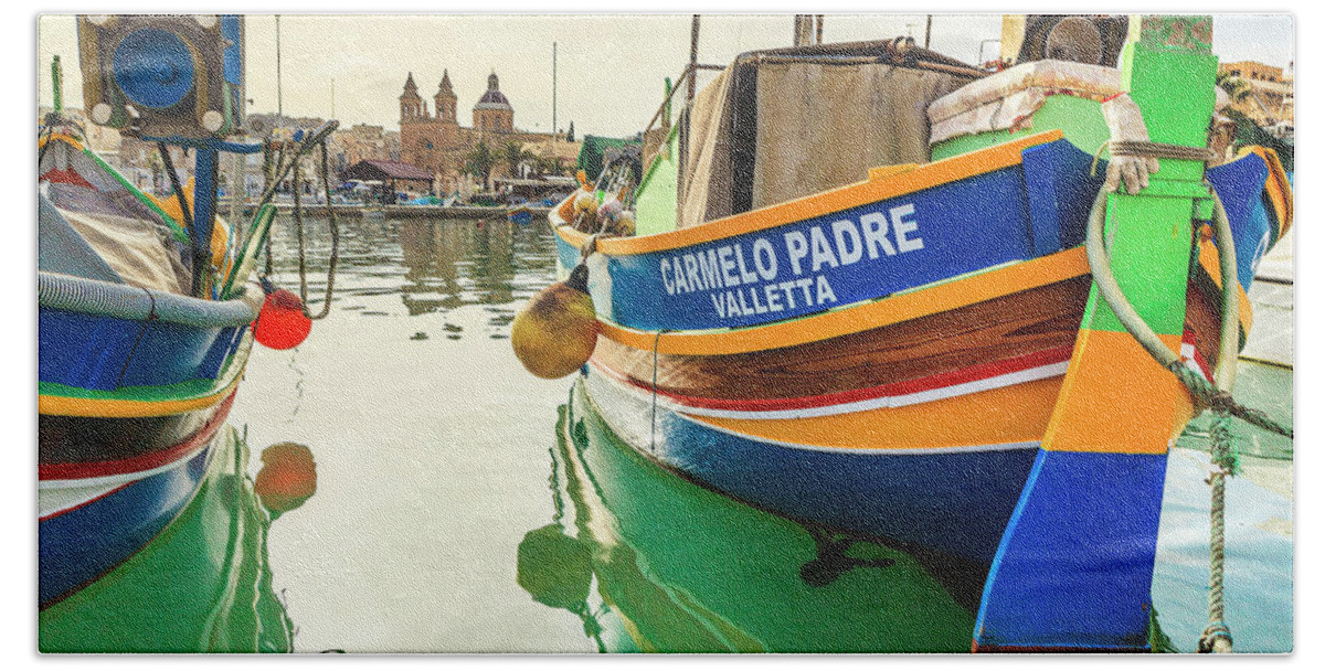 https://render.fineartamerica.com/images/rendered/default/flat/bath-towel/images/artworkimages/medium/2/malta-marsaxlokk-mediterranean-sea-luzzu-traditional-fishing-boats-and-the-parish-church-in-the-background-alessandro-saffo.jpg?&targetx=0&targety=-79&imagewidth=952&imageheight=634&modelwidth=952&modelheight=476&backgroundcolor=F7F5DC&orientation=1&producttype=bathtowel-32-64