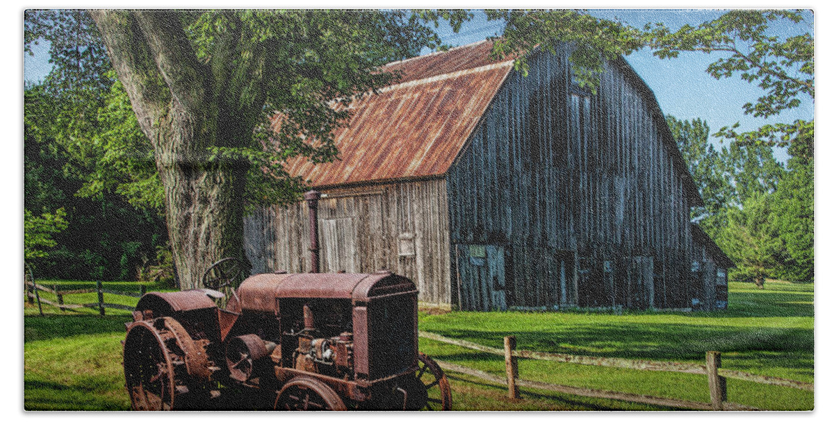 Barn Bath Towel featuring the photograph Old Vintage McCormick Deering Tractor with old weathed Barn by Randall Nyhof