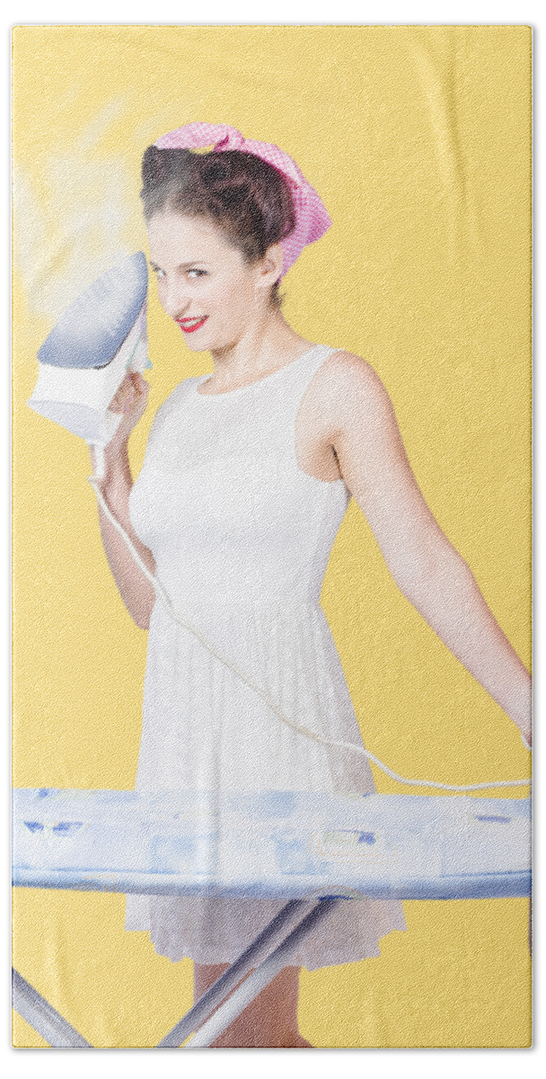 Cleaning Bath Towel featuring the photograph Pin up woman providing steam clean ironing service by Jorgo Photography
