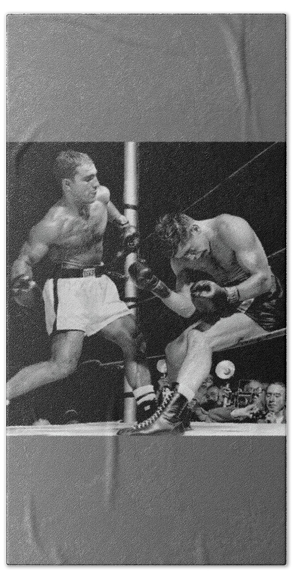 Rocky Bath Towel featuring the photograph Rocky Marciano has Roland Lastarza On The Ropes 1953 by Doc Braham