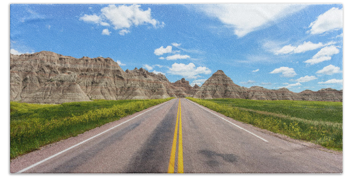 Badlands Bath Towel featuring the photograph The road less traveled by Chris Spencer