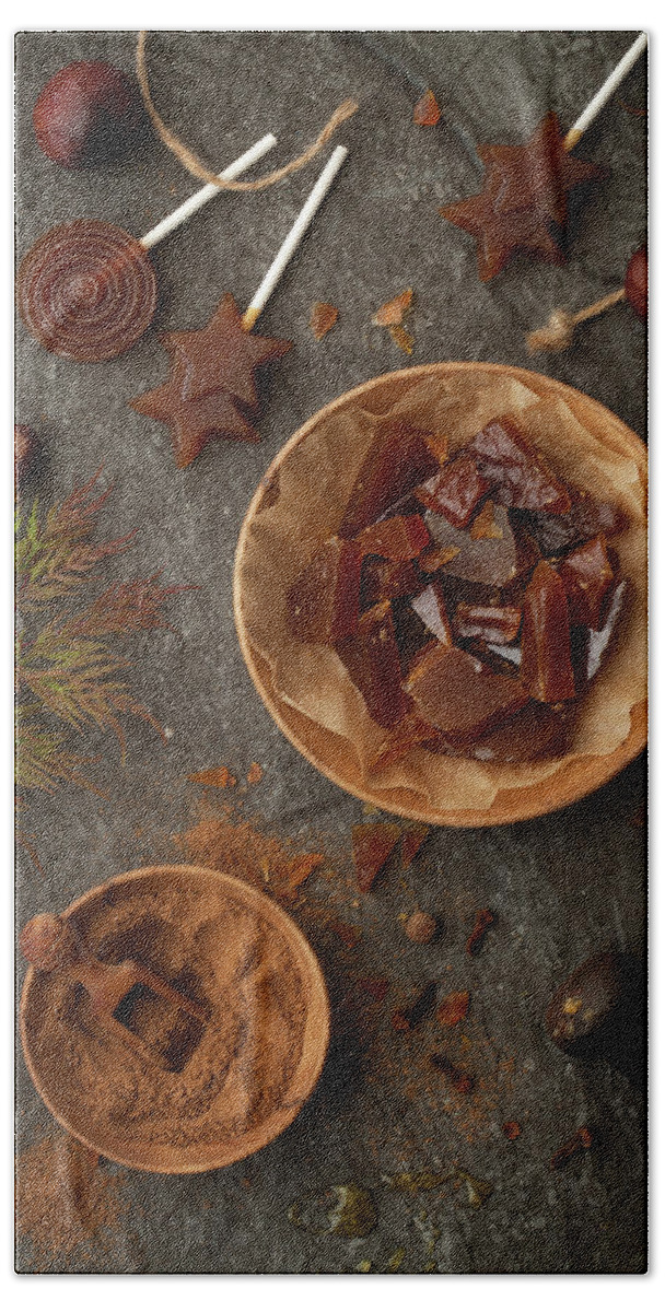 Ip_13179414 Hand Towel featuring the photograph Toffee Lollipops And Hard Toffee Pieces Flavoured With Pumpkin Spice by Jane Saunders