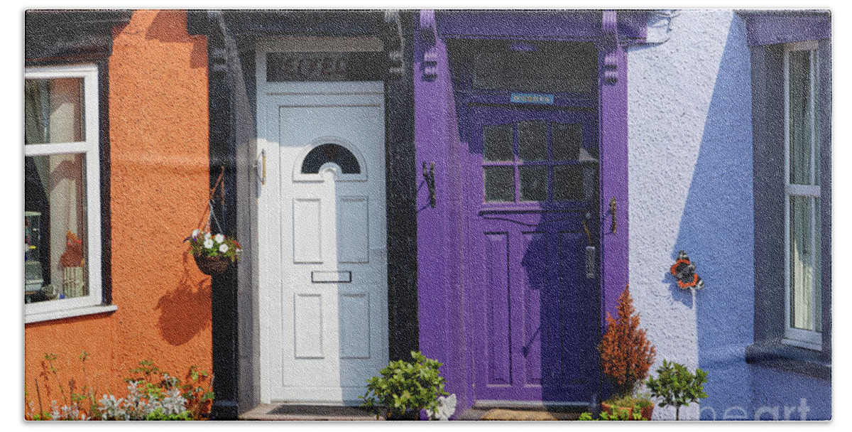 Close Up Hand Towel featuring the photograph Two flashy attractive apartment house doors side by side purple white orange living free living loud by Robert C Paulson Jr