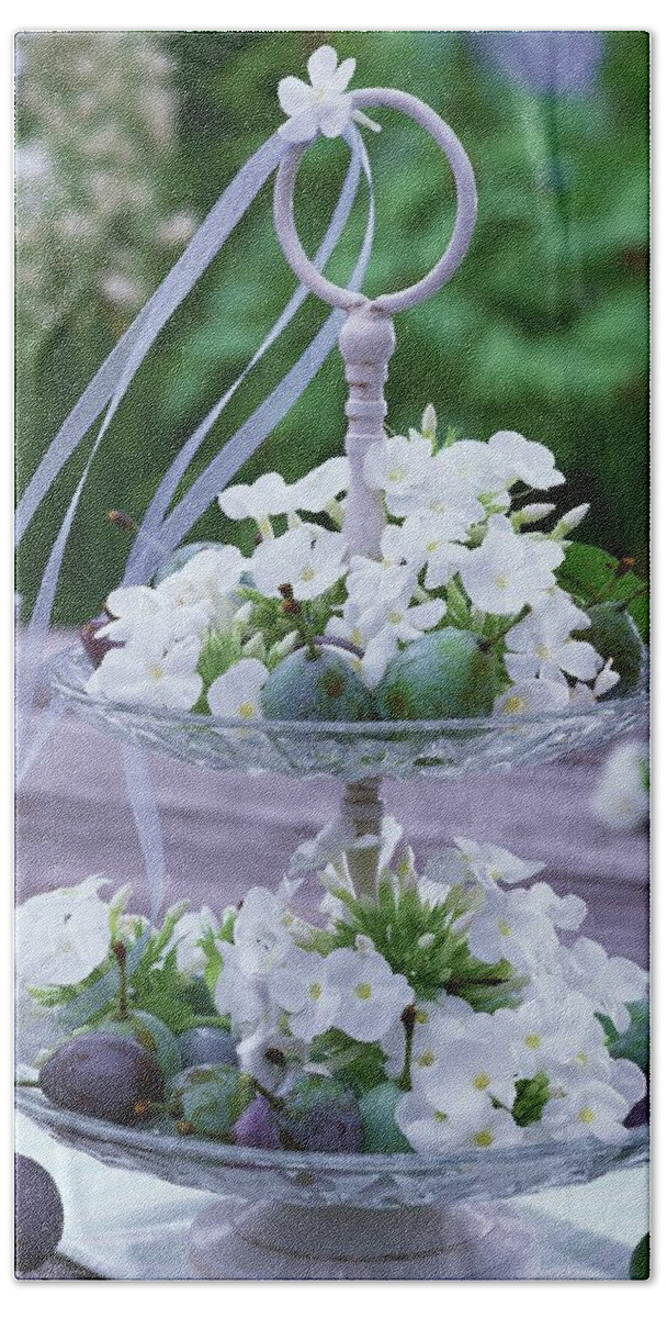 Ip_00263558 Hand Towel featuring the photograph White Phlox And Plums On Tiered Stand On Table by Friedrich Strauss