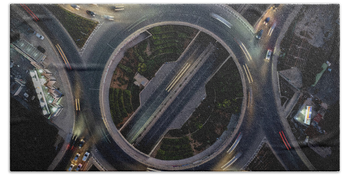 Speed Bath Towel featuring the photograph Aerial drone top view of a modern motorway junction roundabout with cars moving. Transportation infrastructure, #1 by Michalakis Ppalis
