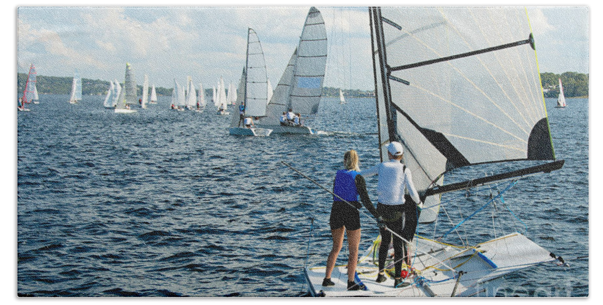 Csne21 Hand Towel featuring the photograph Children Sailing small sailboat stern view on an inland waterway #1 by Geoff Childs